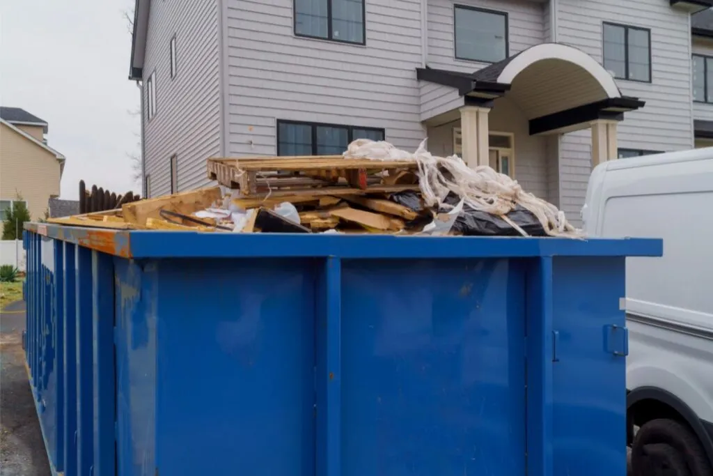 dumpster rental full of garbage for residential house renovation