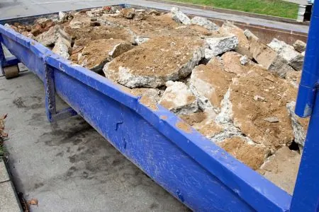 dumpster with construction debris